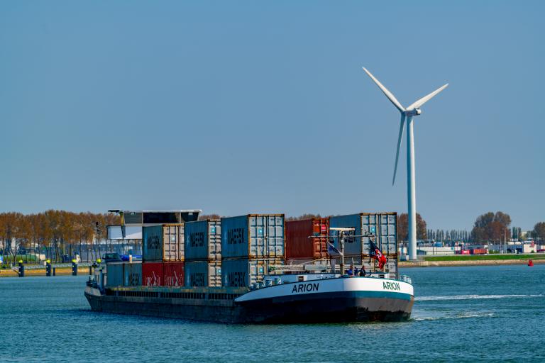 cargo ship with containers on a river