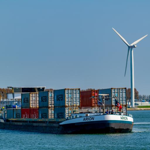 cargo ship with containers on a river