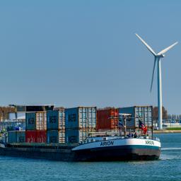 cargo ship with containers on a river